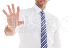 Handsome businessman gesturing with hand