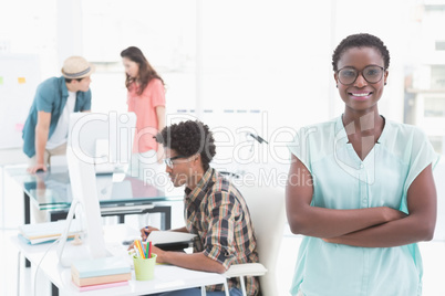 Young creative woman smiling at camera