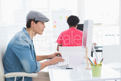 Young creative man working at desk