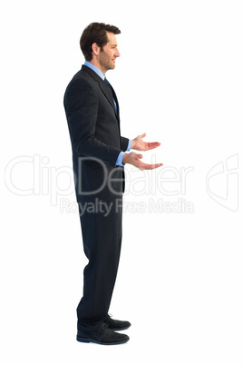 Businessman standing with arms out