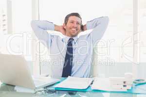 Relaxing businessman at his desk