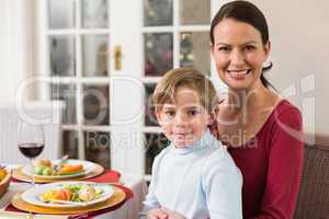 Portrait of mother with her son sitting on lap