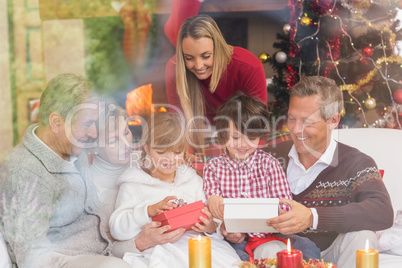 Multi generation family opening presents on sofa