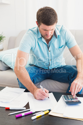 Concentrating man counting his bills