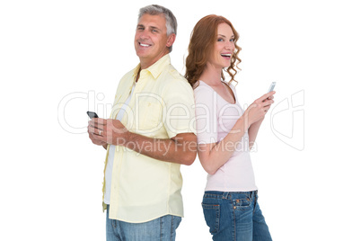 Casual couple sending text messages