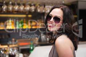 Pretty woman wearing sunglasses with tongue out