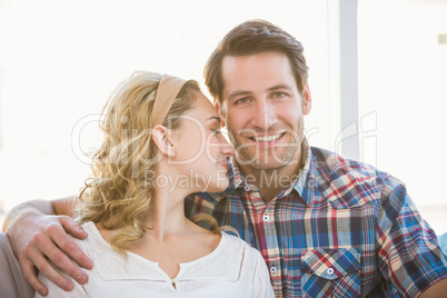 Loving couple sitting on couch