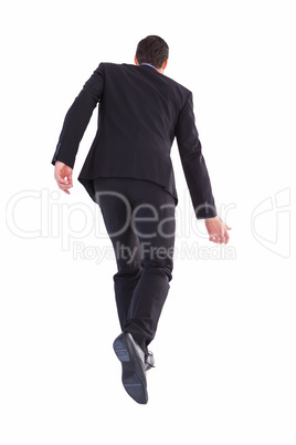 Rear view of businessman walking