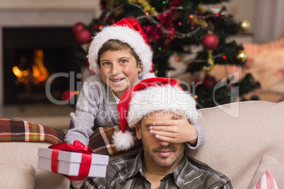 Son surprising his father with christmas gift