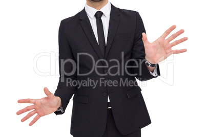 Businessman standing with hands spread out