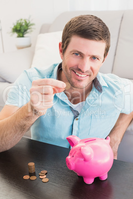 A man showing a pennie