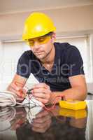 Construction worker working on cables