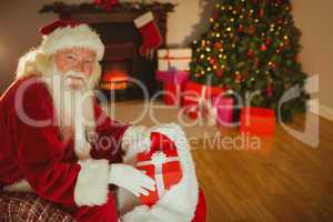 Cheerful santa claus stocking gifts