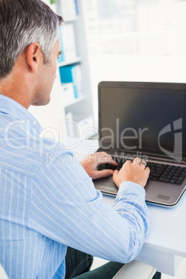 Focused man using his laptop