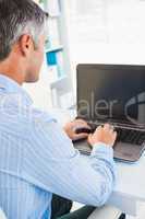 Focused man using his laptop