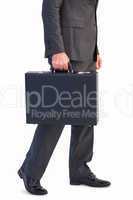 Businessman holding briefcase walking