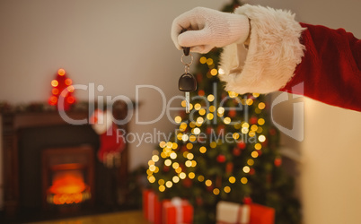 Hand of santa holding car key