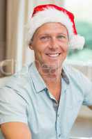 Portrait of handsome man in santa hat