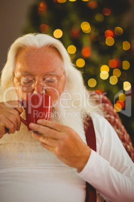 Father christmas drinking hot drink
