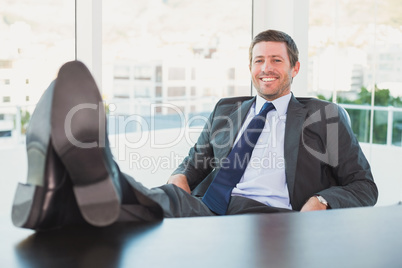 Relaxed businessman with his feet up