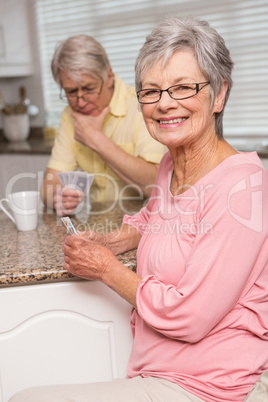 Senior couple playing cards at the counter