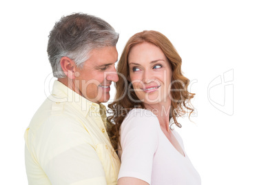 Casual couple hugging and smiling Casual couple hugging and smiling