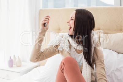 Angry brunette shouting at her phone