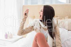 Angry brunette shouting at her phone