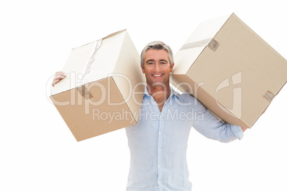 Happy man carrying cardboard boxes