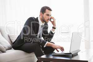 Businessman working on his couch