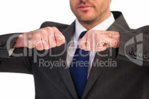 Mid section of a businessman with clenched fist