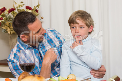 Father with his son sitting on lap