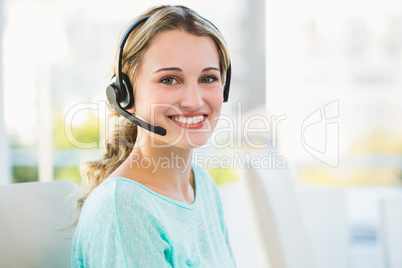Portrait of a smiling creative businesswoman with earpiece