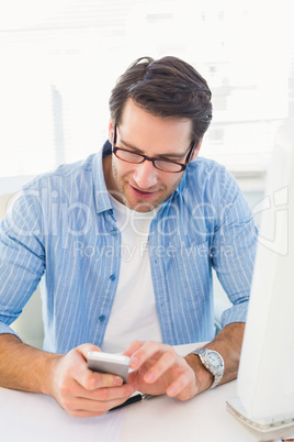 Male photo editor typing text message