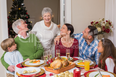 Happy family posing and looking the grandmother