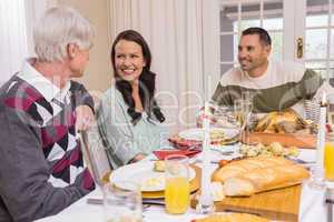 Cheerful family having christmas dinner together
