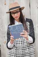 Pretty hipster using tablet pc