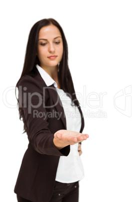 Pretty businesswoman presenting with hand