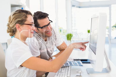 Smiling photo editors using computer