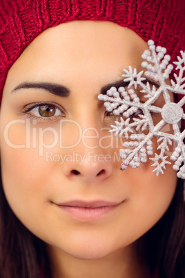 Close up of a brunette holding snowflake