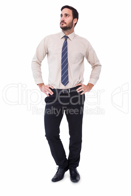 Businessman standing with hands on hips