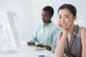 Businesswomen working together at desk