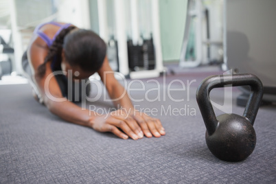 Fit woman working out with kettlebell