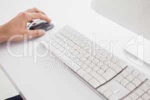Businessman using the computer mouse