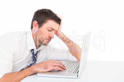 Focused businessman working on his laptop