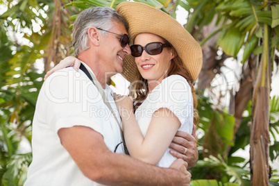 Holidaying couple hugging and smiling