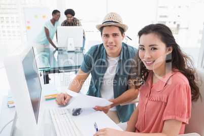 Young creative team working at desk