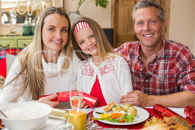 Portrait of parents and daughter together at christmas time