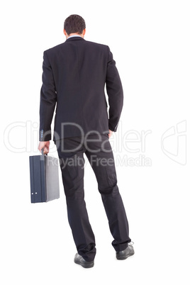 Rear view of businessman holding a briefcase Rear view of businessman holding a briefcase