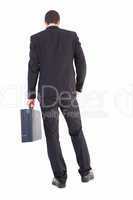 Rear view of businessman holding a briefcase